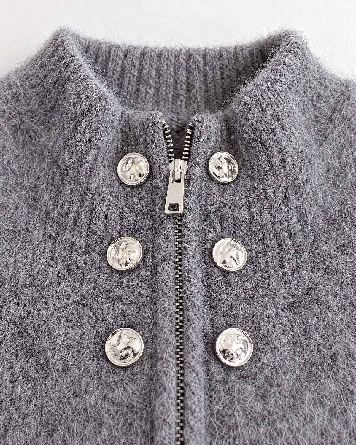 High collar, two-way zip and silver button detail
