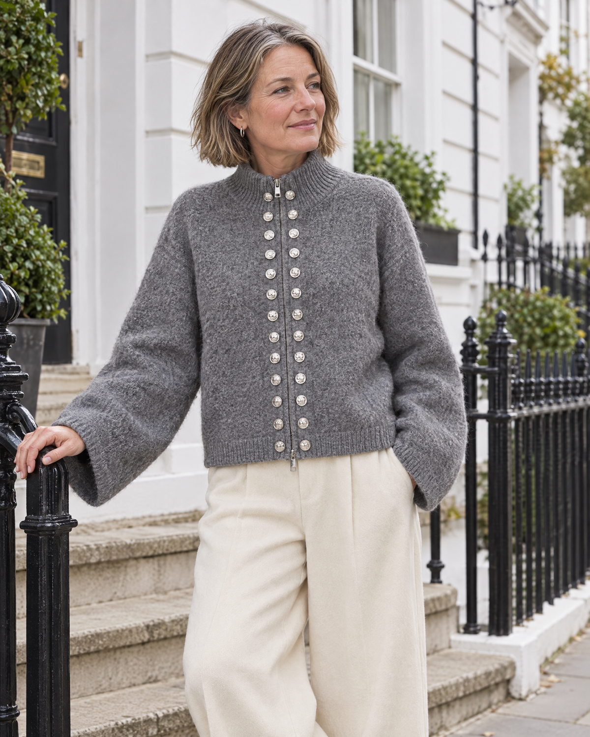 Hampstead cardigan worn on the steps of a Kensington townhouse